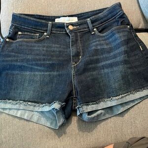 Levi’s high rise shorts size 10 waist is 30.  Has a slight cuff with fraying.